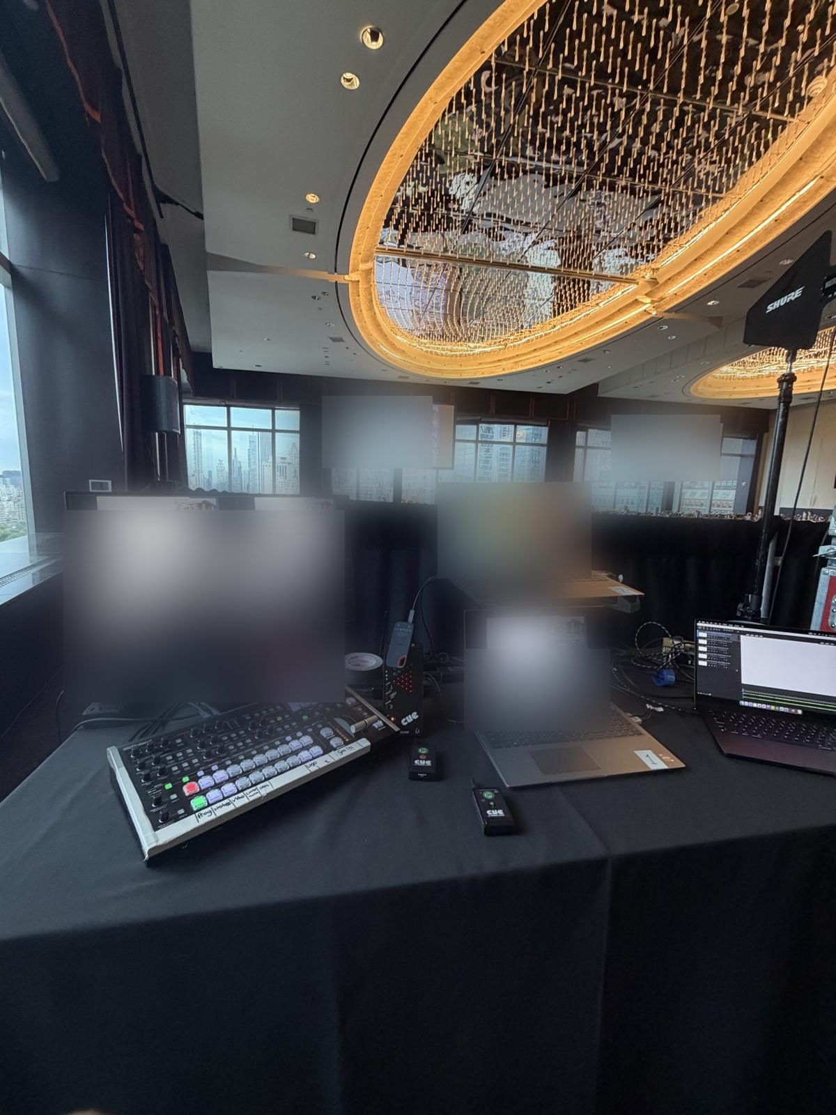 Video village for an investor meeting: switching console, multiview monitors, and playback laptops