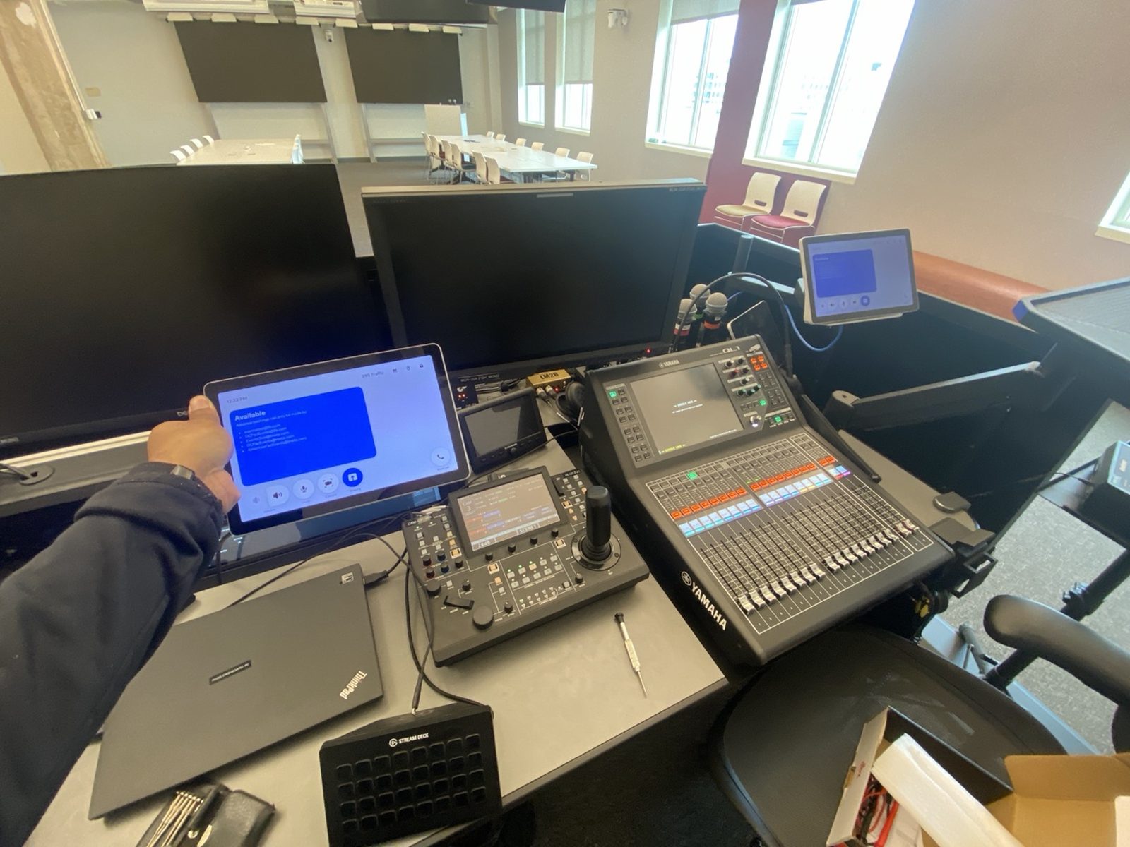 Yamaha QL1 console with PTZ camera controller in a hybrid meeting space